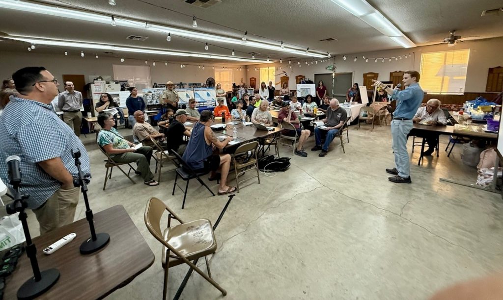 Joe Shea, Assistant Secretary for Salton Sea Policy providing opening remarks in front of room with participants sitting.